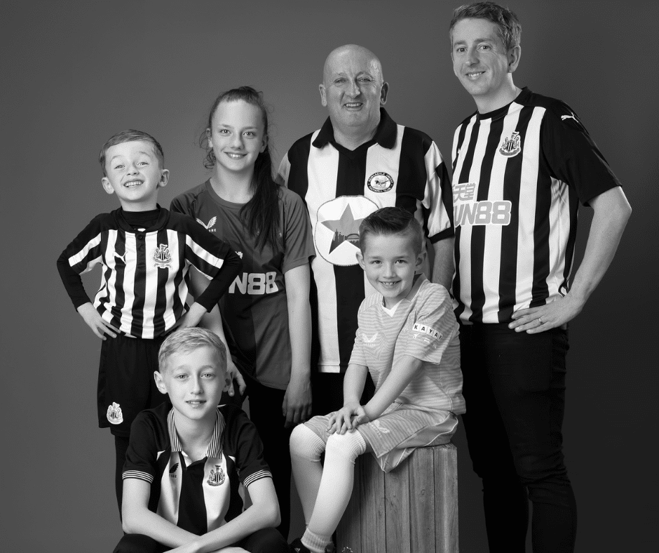 Family in Newcastle United football shirts